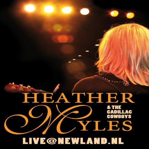 DVD cover featuring a blonde woman holding a guitar under stage lights.