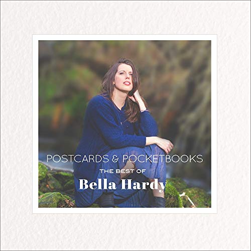 "Album cover with a woman in blue sitting by a forest stream."