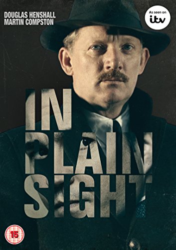 DVD cover featuring a man in a hat and coat with "In Plain Sight" text.