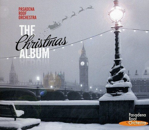 "CD cover with snowy London scene, lamp post, and Big Ben, titled 'The Christmas Album'."