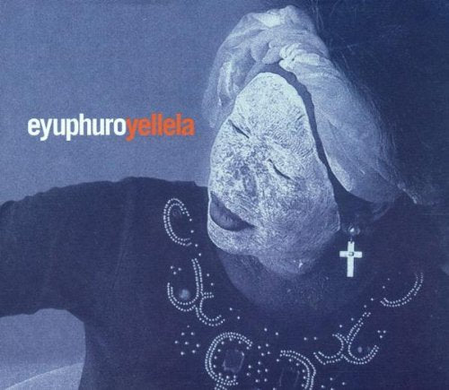 A blue-toned album cover featuring a woman with her eyes closed and a cross necklace.