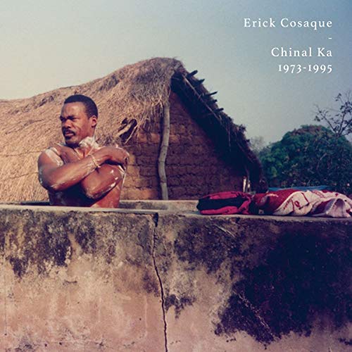 "CD cover featuring a man tied up, with a thatched hut in the background."