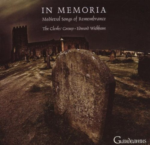 "CD cover with a graveyard scene and a large tombstone in the foreground."