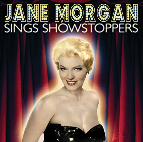 "CD cover featuring Jane Morgan in a black dress, with red stage curtains."