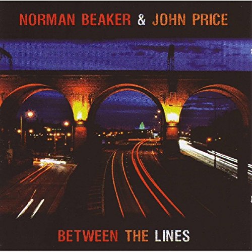 Album cover with nighttime train tracks under a bridge, lit by orange and white lights.