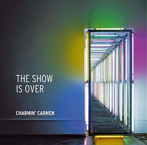 "Album cover featuring a neon-lit hallway with 'THE SHOW IS OVER' and 'CHARMIN' CARMEN' text."