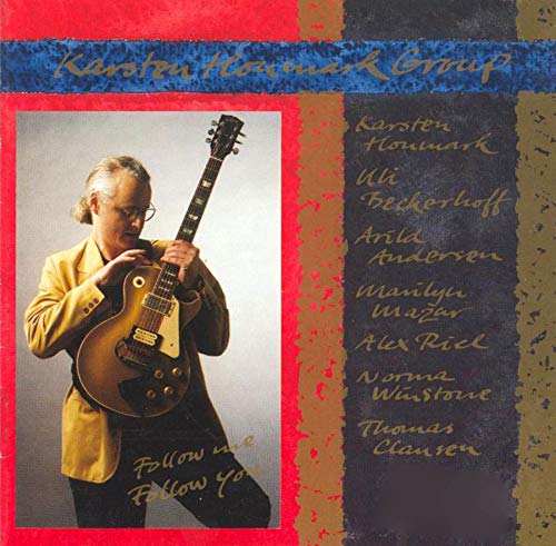 Album cover with a man holding a guitar, surrounded by text and abstract design.