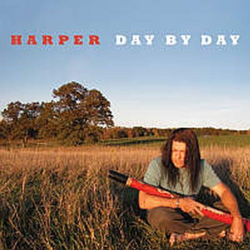 Album cover featuring a man sitting in a field with a red flute.