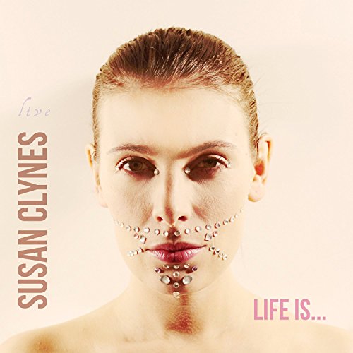 Album cover with a woman's face adorned with rhinestones and text "SUSAN CLYNES LIFE IS..."
