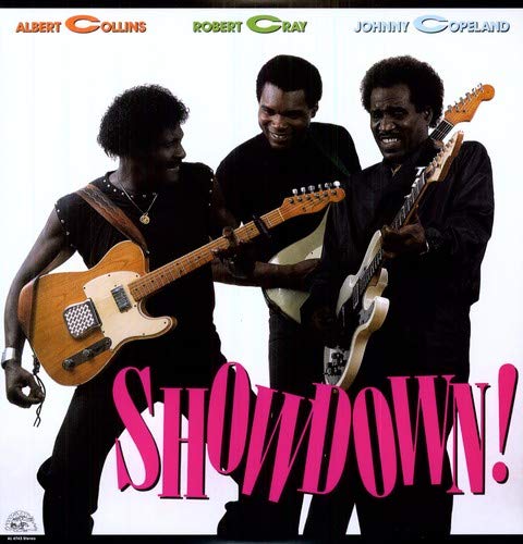 Vinyl album cover featuring three black men playing guitars, with "SHOWDOWN!" text.