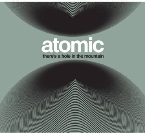 "Album cover with 'atomic' in white text and 'there's a hole in the mountain' on muted green."