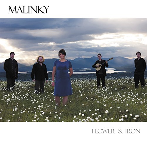 Album cover with five people standing in a field of white flowers.