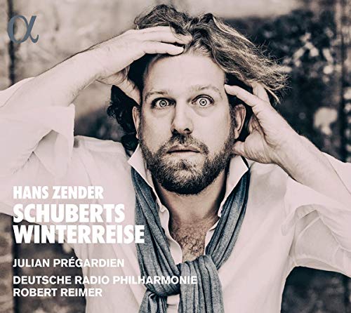 Man with hands on head, white shirt, blue scarf, on a music CD cover.