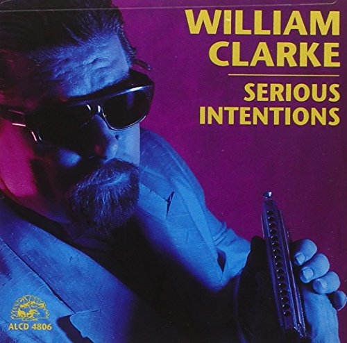 Album cover with man holding harmonica, wearing sunglasses, against a red background.