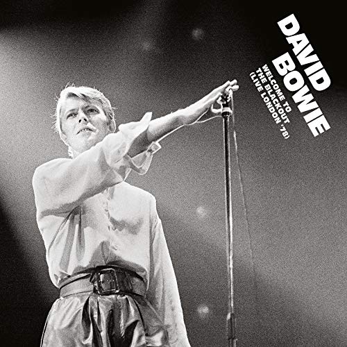 "David Bowie album cover featuring a black-and-white photo of him singing into a microphone."