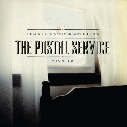Album cover with a dimly lit bedroom scene and bold title text.