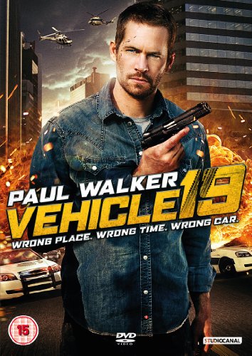 "Paul Walker holding a gun, with explosions and cars in the background."