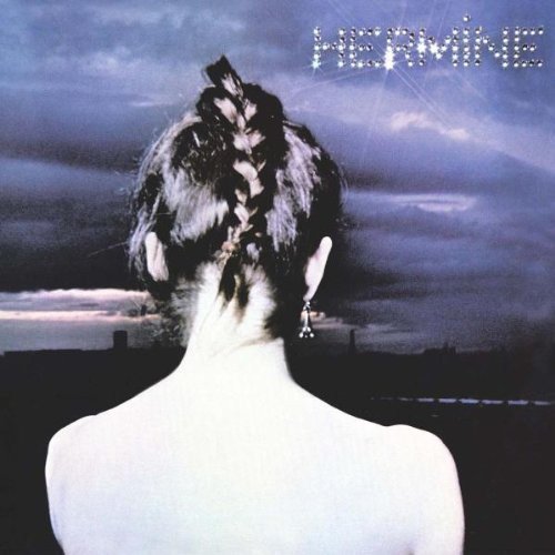 Album cover featuring a woman with dark hair against a cloudy sky.