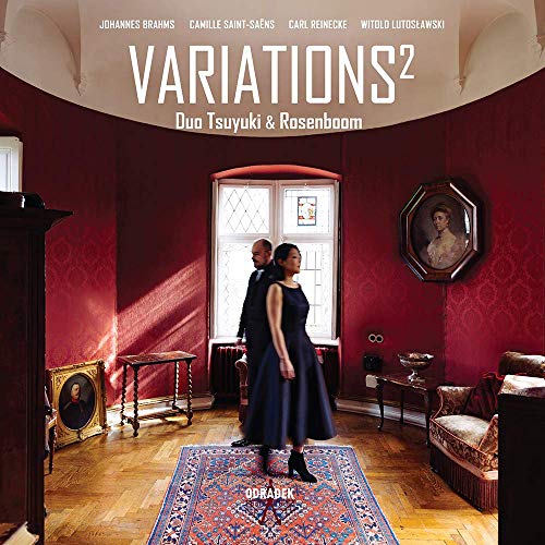 CD album cover with a man and woman in a red room.