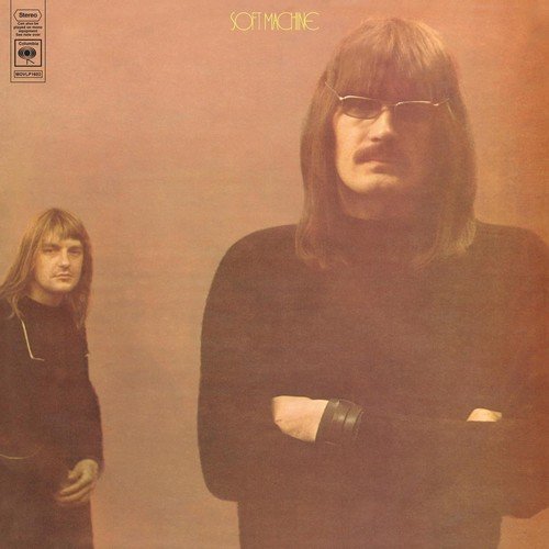 Vinyl album cover with two men, one large and one small, against a red background.