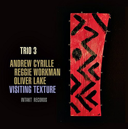 Album cover with red and black abstract art on a black background.