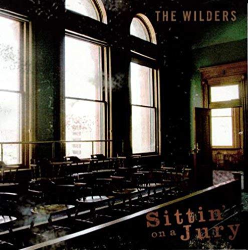 "Album cover featuring a dimly lit courtroom with large windows and wooden benches."
