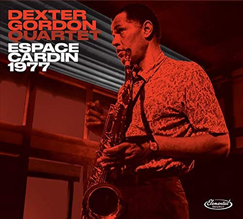 "Album cover featuring a man playing saxophone, red-toned image with text."