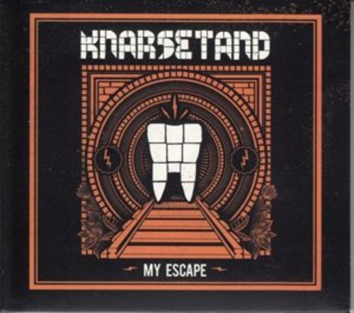 "Album cover with a tooth in a circular design on a black background."