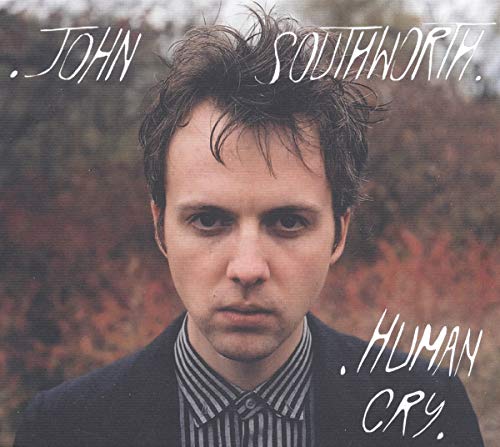 Album cover featuring a man with messy hair and a serious expression.