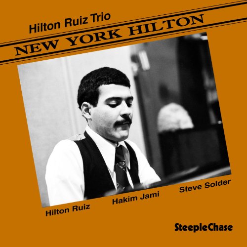 Orange album cover with black-and-white photo of man at piano and names listed.