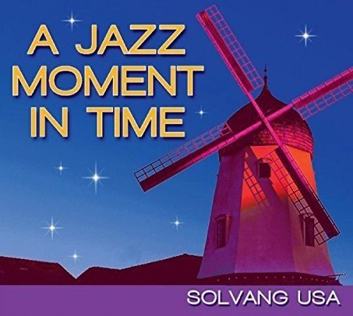 "Album cover with a pink-lit windmill against a starry blue sky, titled 'A Jazz Moment In Time'."