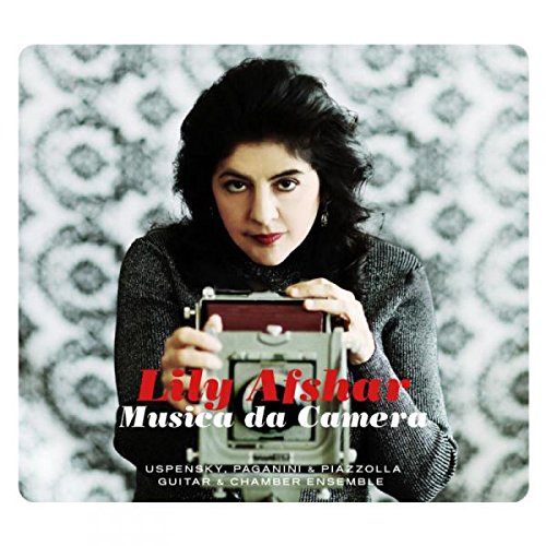 "CD cover featuring a woman holding a camera, with text overlay."