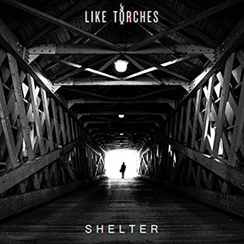 "Album cover featuring a person walking towards light in a dark tunnel."