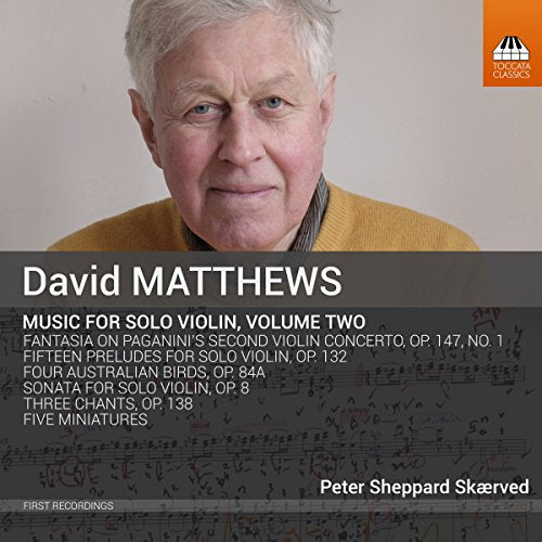 CD cover featuring a man with white hair wearing a yellow sweater.