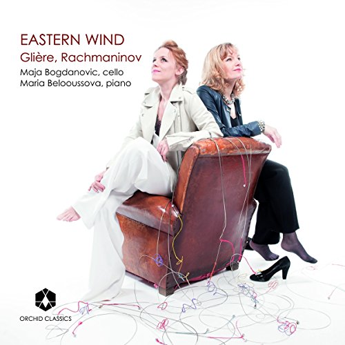 Album cover featuring two women sitting on a worn brown leather chair.