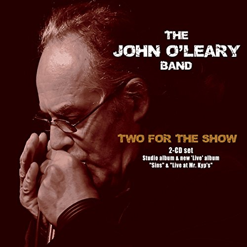 "Album cover featuring a man holding a microphone, with text describing the 2-CD set."