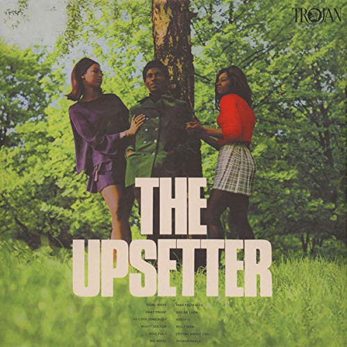 Vinyl record cover with "The Upsetter" text, featuring three people in a forest.