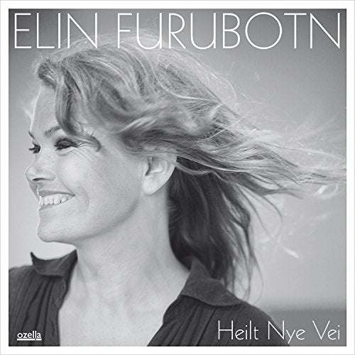 Black and white CD cover featuring a smiling woman with blowing hair.