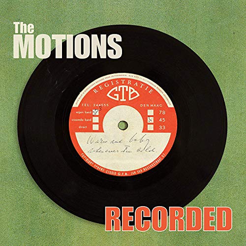 "Black vinyl record with red and white label on a green background."