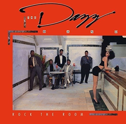 "Dazz Band album cover with red background, band members, and a woman."