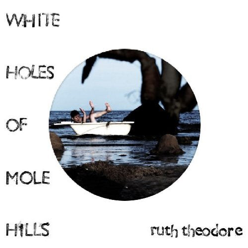 "CD cover with a person in a white boat, surrounded by water and rocks."