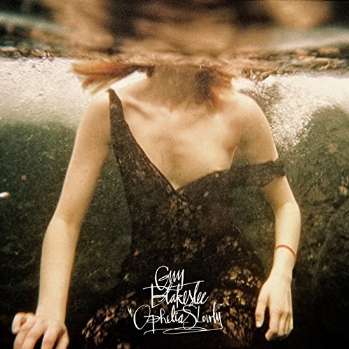 "Vinyl album cover featuring a woman submerged in water, wearing a dark lace dress."