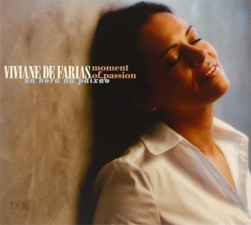 Woman in white shirt leaning against wall, eyes closed, on album cover.
