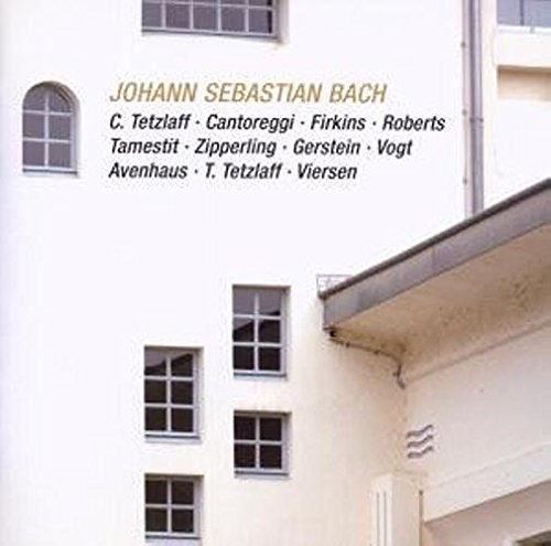 A CD cover featuring a white building facade with multiple windows.