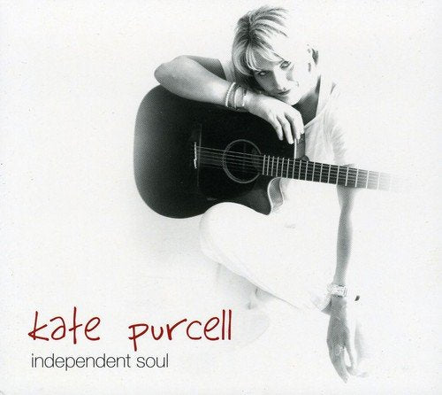 Album cover with a black and white photo of a woman holding a guitar.