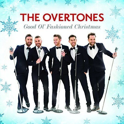 "CD cover featuring five men in tuxedos holding microphones, surrounded by snowflakes."