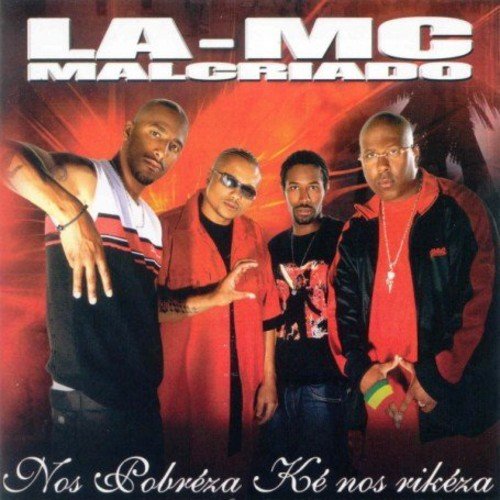 "Album cover with four men standing in front of a red background."