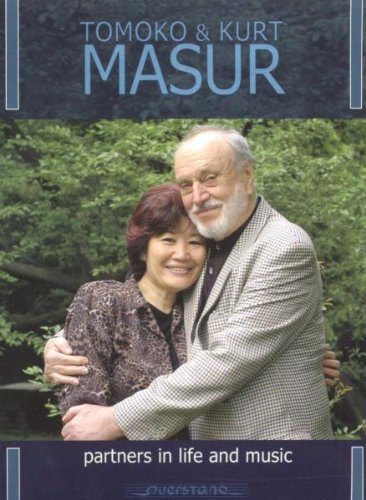 CD cover featuring Tomoko and Kurt Masur embracing, with blue banner and text overlays.
