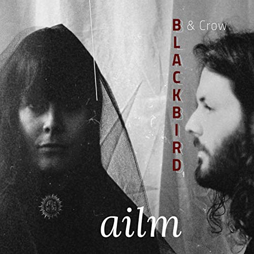 Black and white album cover featuring a man and woman with text "Blackbird & Crow" and "ailm".