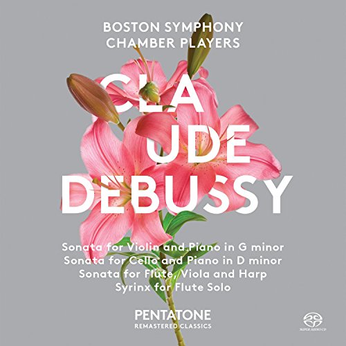 A grey CD cover featuring a pink lily and white text about Debussy.